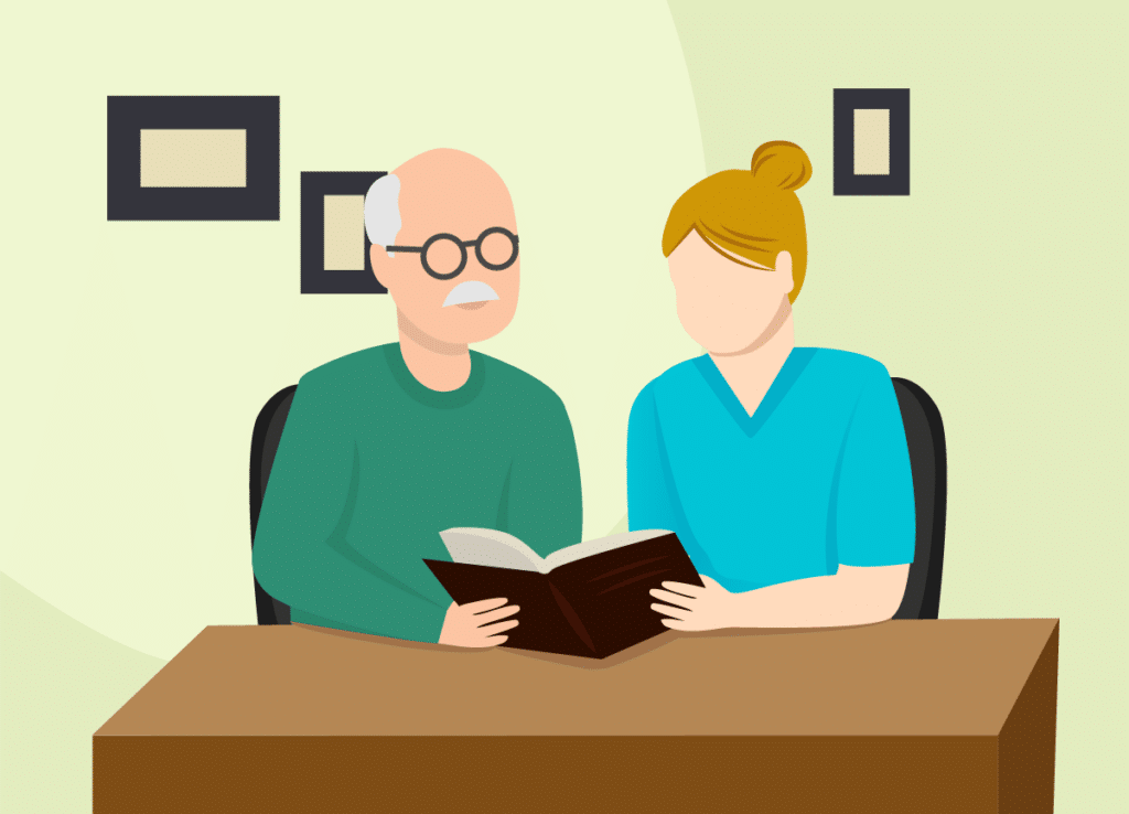 Pflegekraft liest einem Senioren zuhause vor